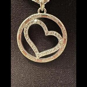 Sparkle with Elegance in a Candies Heart-Shaped Necklace!